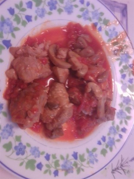 Sauté de porc au curry, tomates et champignons